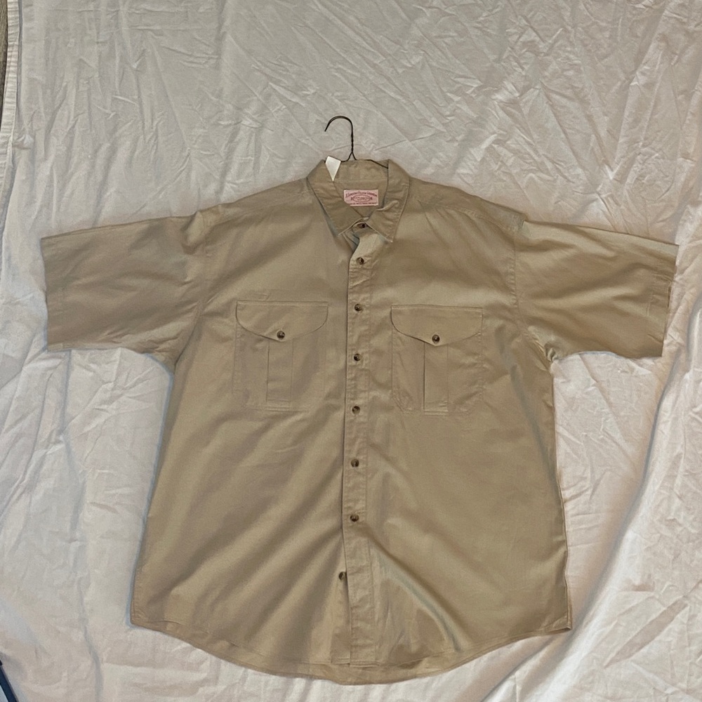 A light brown Men’s button down casual shirt. New barely worn.